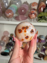 Load image into Gallery viewer, Peachy Banded Carnelian Sphere
